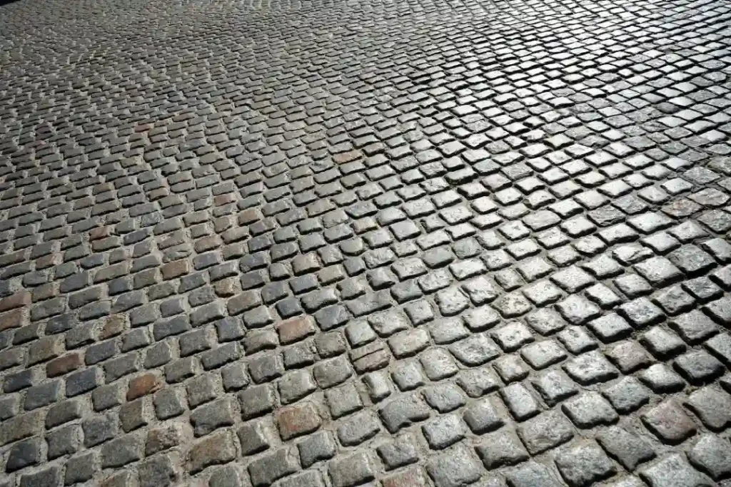 A street with granite cobblestone driveways